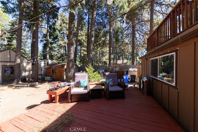 wooden terrace featuring a storage unit