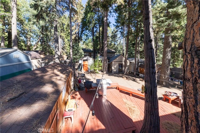 wooden deck featuring a shed