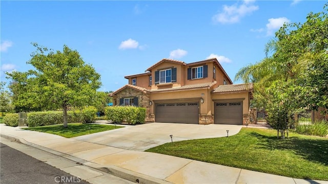 mediterranean / spanish home featuring a front lawn and a garage