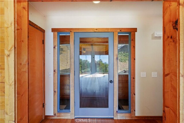22781 Crest Forest Dr Unit 2048, Crestline, CA 92325 - doorway featuring baseboards and wood finished floors