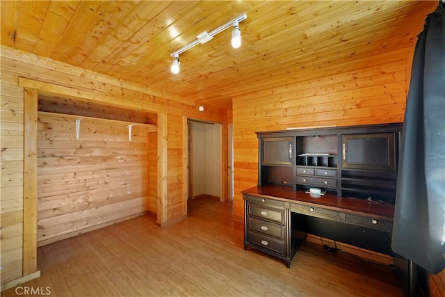 home office with wooden ceiling, wooden walls, wood finished floors, and rail lighting