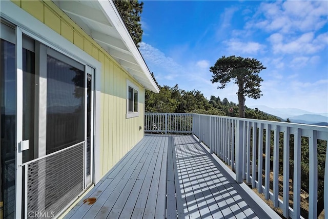 wooden deck with a mountain view