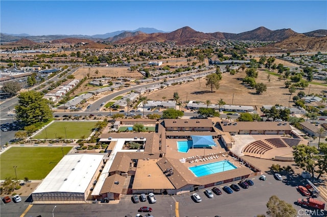 birds eye view of property with a mountain view