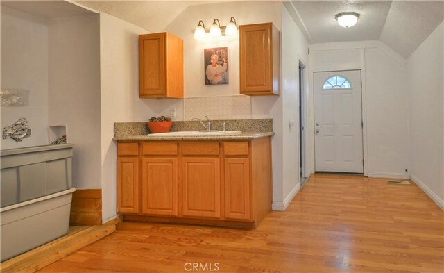 794 Virginia Ct, Lake Arrowhead, CA 92352 - kitchen with light wood-style floors, brown cabinets, and light countertops