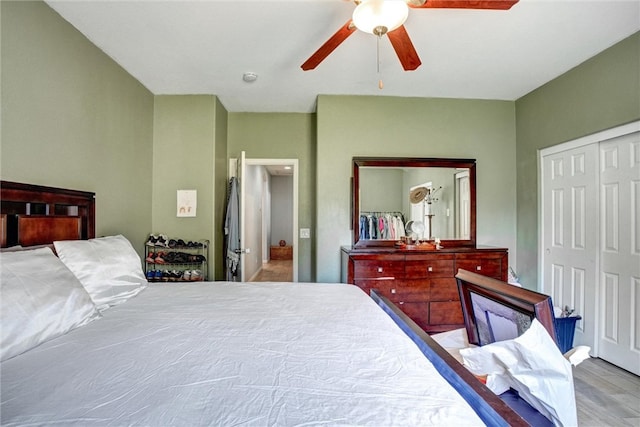 bedroom featuring a closet, light hardwood / wood-style floors, and ceiling fan