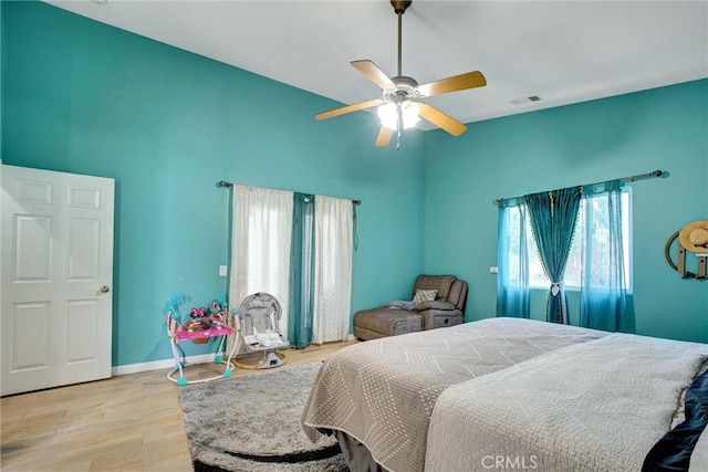 bedroom featuring light hardwood / wood-style floors and ceiling fan