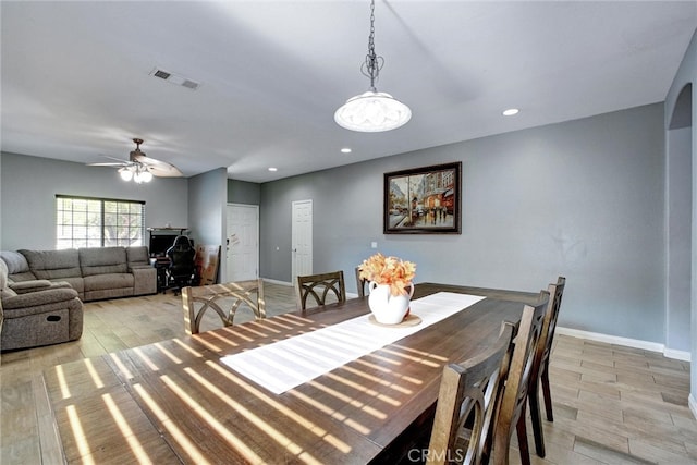 dining space featuring ceiling fan and light hardwood / wood-style flooring