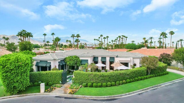 view of front of property with a mountain view