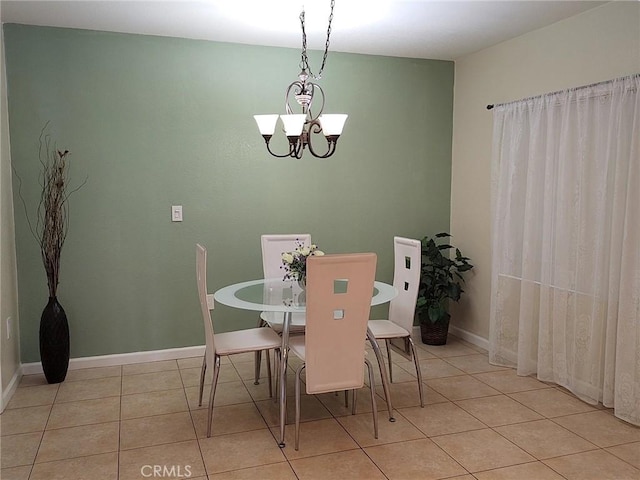 dining room with a notable chandelier and light tile patterned flooring