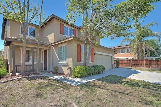 view of front of property with a porch and a garage