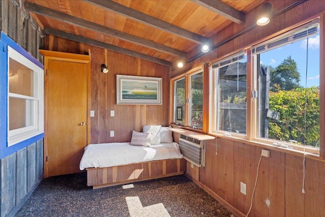 unfurnished bedroom featuring lofted ceiling with beams, wooden ceiling, a wall unit AC, and wood walls