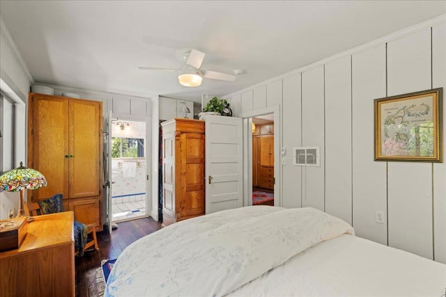 bedroom featuring crown molding, access to outside, dark hardwood / wood-style floors, and ceiling fan