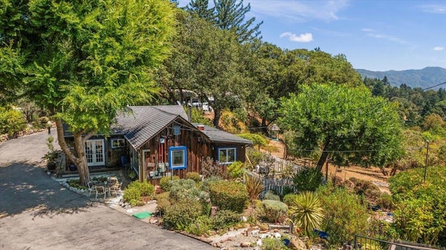 view of front of home featuring a mountain view and french doors