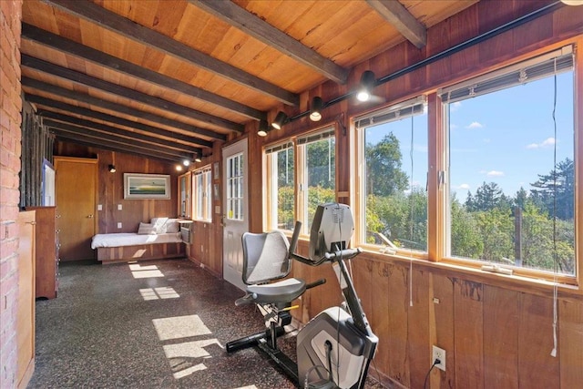 unfurnished sunroom featuring wood ceiling and lofted ceiling with beams