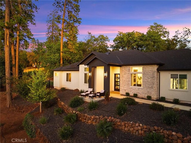 5772 Acorn Ridge Dr, Paradise, CA 95969 - view of front of home featuring a patio area, brick siding, and a shingled roof