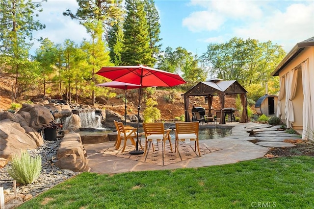 view of patio featuring a gazebo and a swimming pool