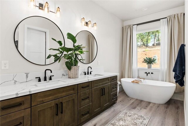 5772 Acorn Ridge Dr, Paradise, CA 95969 - full bath featuring double vanity, wood finished floors, and a soaking tub