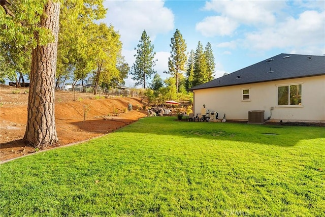 view of yard with central AC