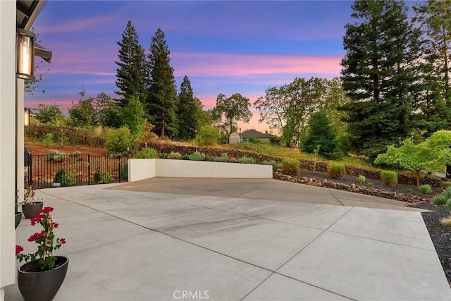 view of patio terrace at dusk