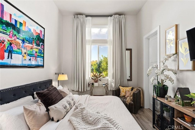 bedroom with wood-type flooring