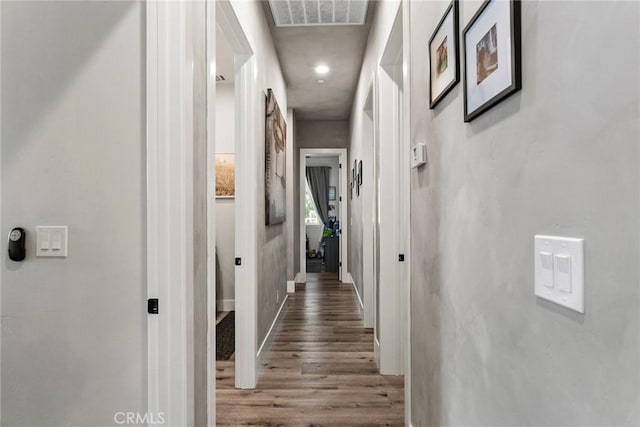 hallway with wood-type flooring