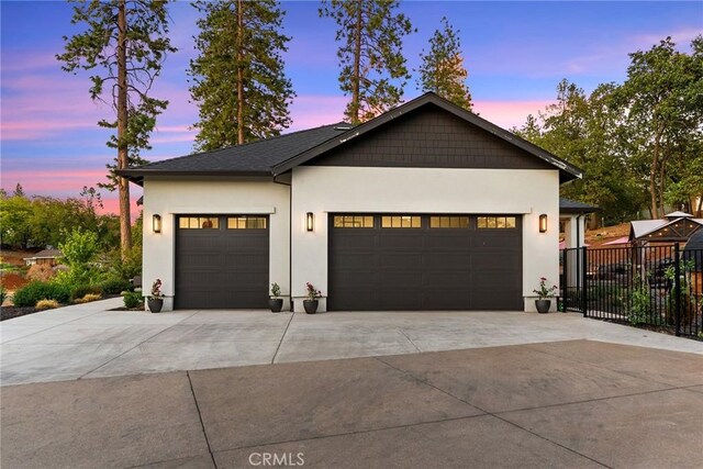 5772 Acorn Ridge Dr, Paradise, CA 95969 - view of front of house with concrete driveway, an attached garage, and stucco siding