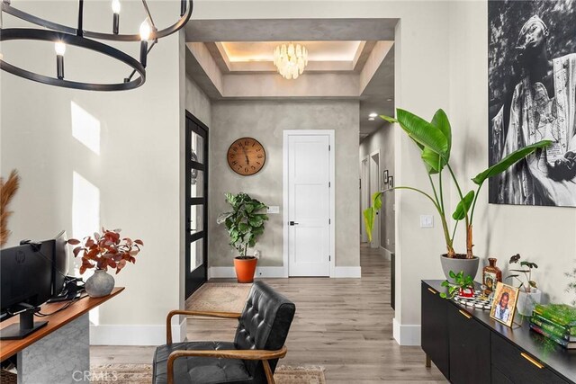 5772 Acorn Ridge Dr, Paradise, CA 95969 - entryway with a chandelier, light wood-style floors, and a tray ceiling