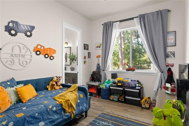 5772 Acorn Ridge Dr, Paradise, CA 95969 - bedroom featuring wood finished floors and ensuite bath