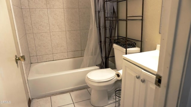 full bathroom with tile patterned flooring, shower / tub combo, vanity, and toilet