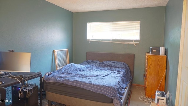 bedroom featuring a textured ceiling