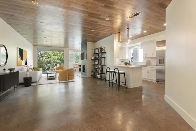 living room with wooden ceiling