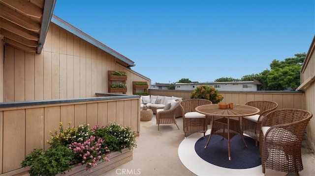 balcony with outdoor lounge area and a patio