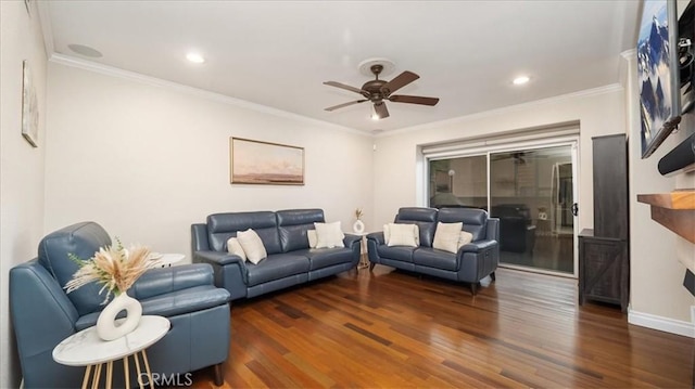 living room featuring dark hardwood / wood-style floors, ceiling fan, and ornamental molding