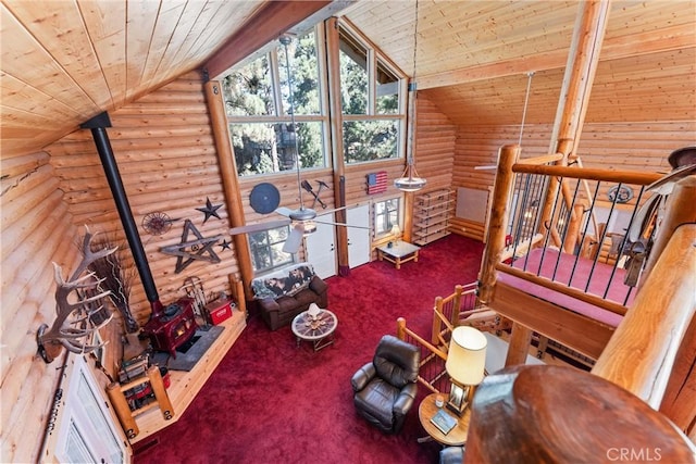 sitting room with vaulted ceiling, carpet, and wooden ceiling