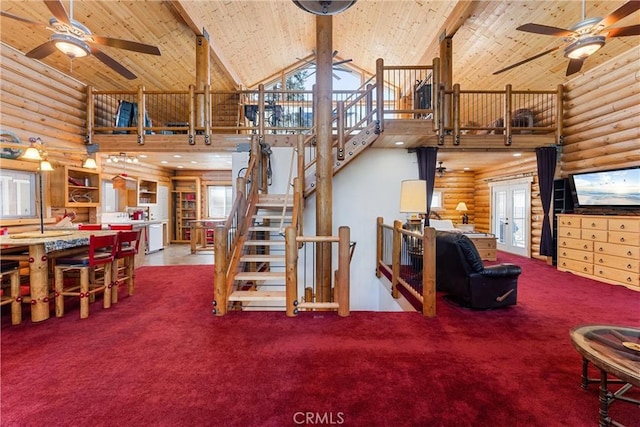 living room featuring plenty of natural light, high vaulted ceiling, carpet, and wooden ceiling