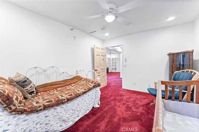 bedroom featuring ceiling fan and carpet