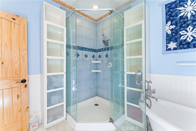 bathroom featuring shower with separate bathtub