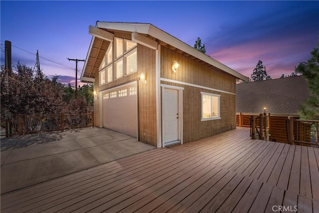 deck at dusk with a garage