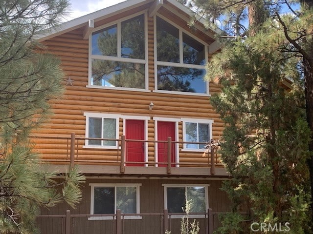 view of home's exterior with a balcony