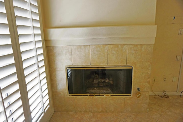 details with a tile fireplace