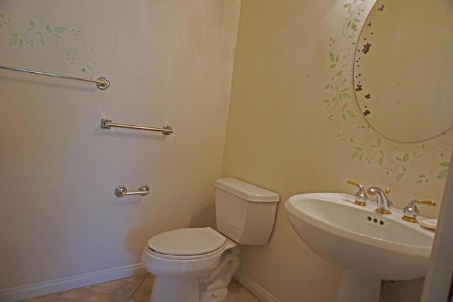 bathroom with sink, tile patterned floors, and toilet