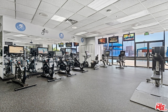 gym featuring a paneled ceiling