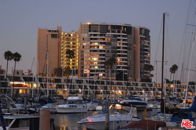 outdoor building at dusk featuring a water view