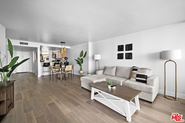 living room with hardwood / wood-style floors