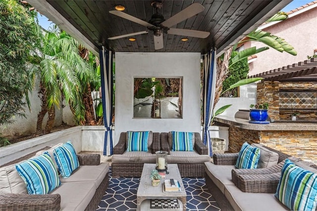 view of patio with an outdoor hangout area and a ceiling fan