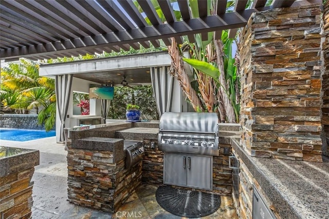 view of patio featuring a ceiling fan, exterior kitchen, grilling area, an outdoor pool, and a pergola