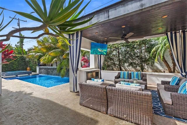 view of patio / terrace with an outdoor pool, outdoor lounge area, and ceiling fan