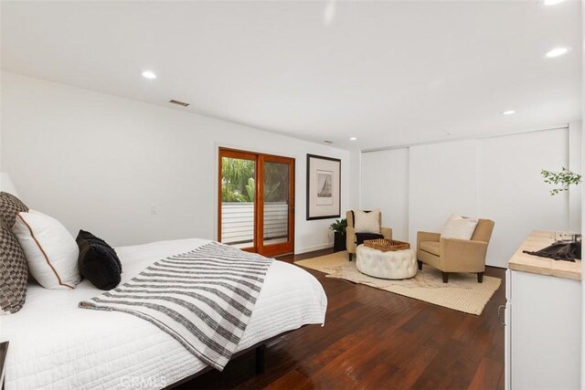 bedroom featuring access to outside, a closet, wood finished floors, and recessed lighting