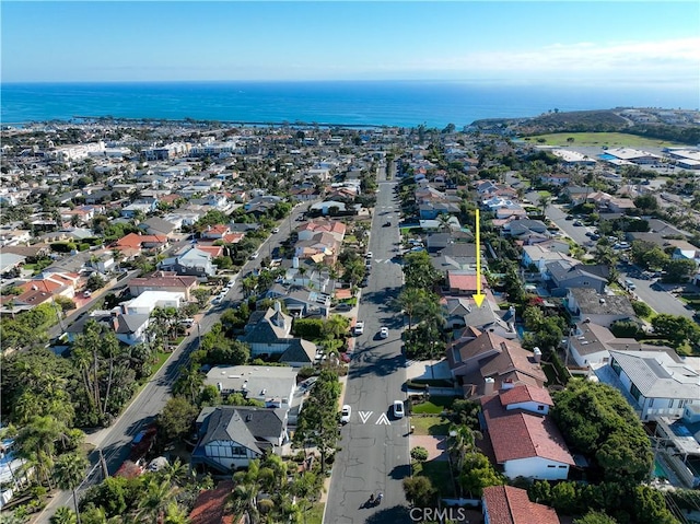 drone / aerial view with a residential view and a water view