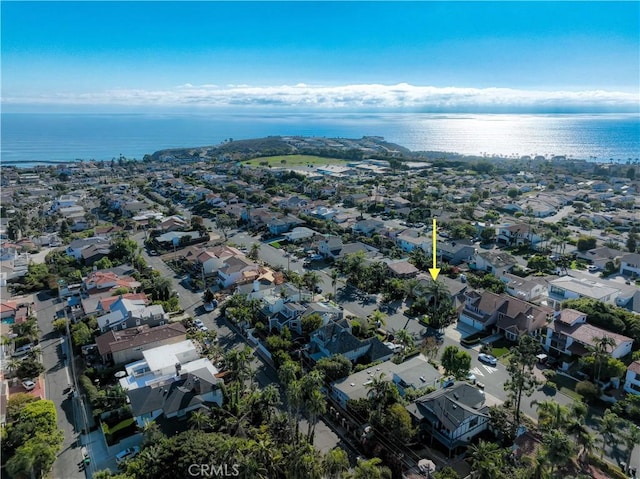 bird's eye view featuring a water view and a residential view